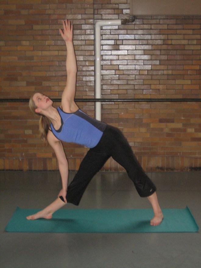 Triangle Pose, one of the 12 Yoga Poses for Bone Strength, and easing osteoporosis