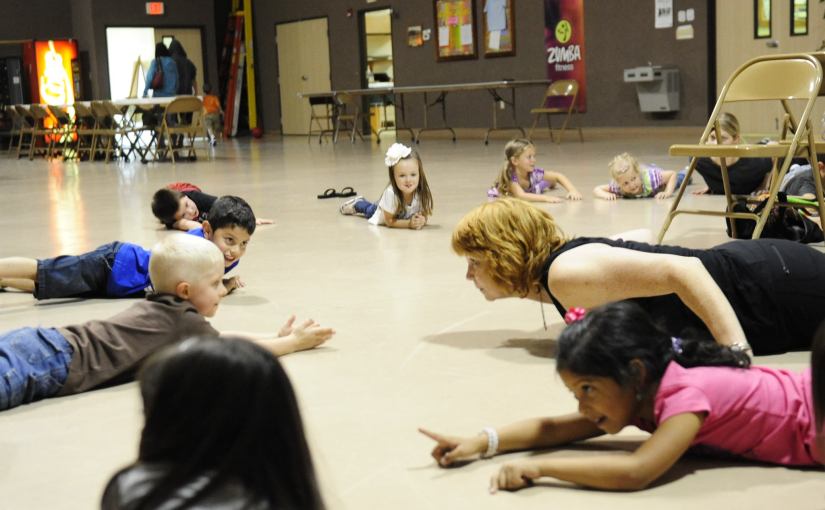 YogaKiddos doing the Snake Pose at Wesley UMC, with Kids Yoga Teacher, Gail Pickens-Barger
