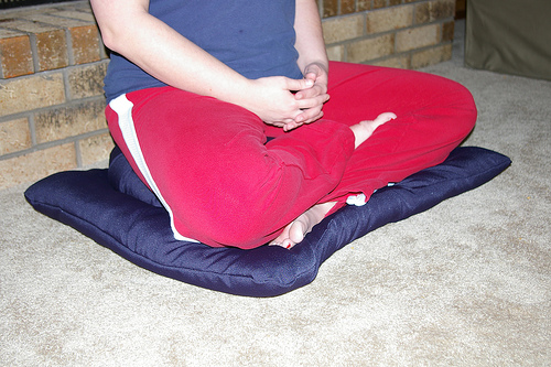 Crossed Legged on the Meditation Zafu & Button